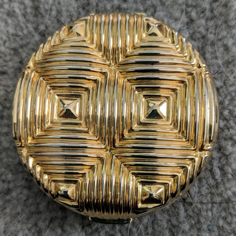 Brass make up compact